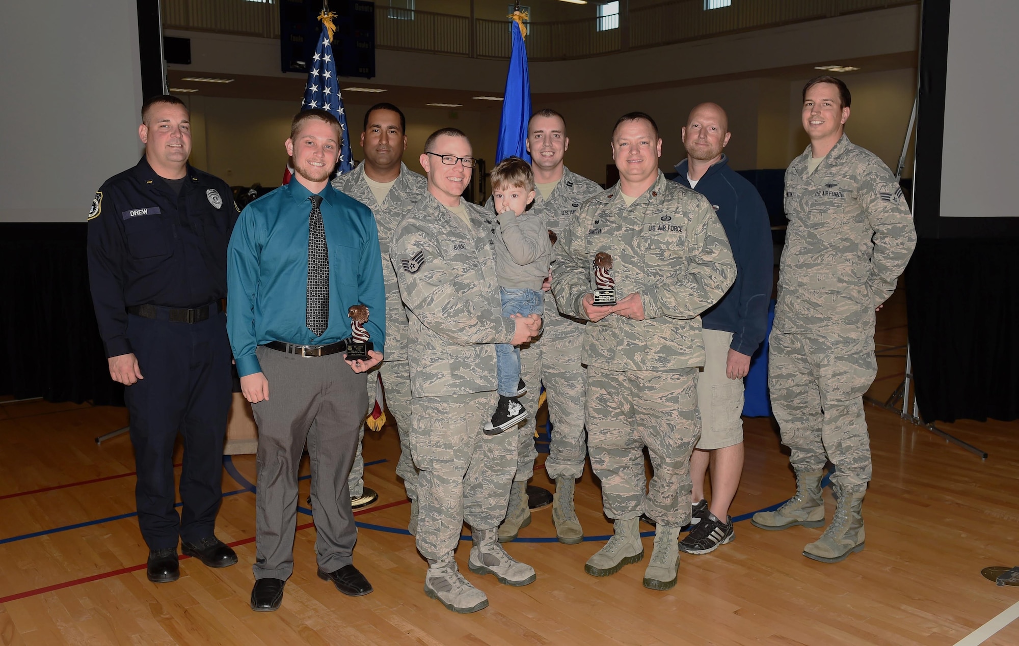 460th Space Wing quarterly award winners stand together after a ceremony Oct. 29, 2015, at the fitness center on Buckley Air Force Base, Colo. Each nominee had to submit a package and in front of a board to compete for the winning title. (U.S. Air Force photo by Airman 1st Class Samantha Meadors/Released)
