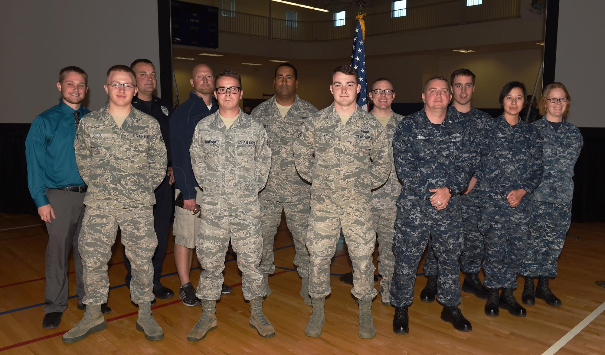 Team Buckley quarterly award winners stand together after a ceremony Oct. 29, 2015, at the fitness center on Buckley Air Force Base, Colo. Each nominee had to submit a package and go in front of a board to compete for the winning title. (U.S. Air Force photo by Airman 1st Class Samantha Meadors/Released)