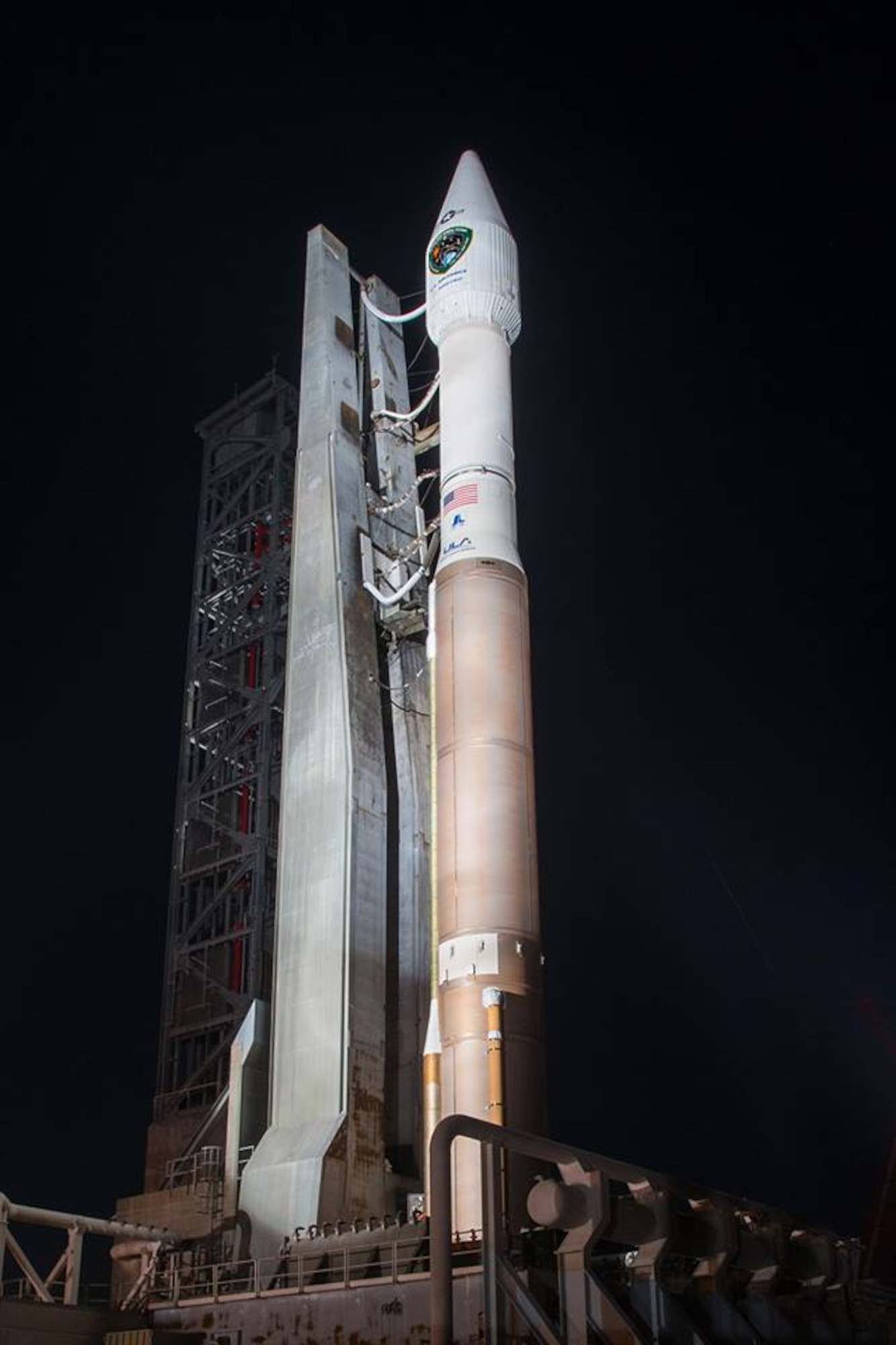 Bathed during the night by a bank of xenon lights, a United Launch Alliance Atlas V 401 with the GPS IIF-11 satellite stands ready for a Halloween afternoon liftoff on Oct. 31 at Space Launch Complex-41 at Cape Canaveral Air Force Station, Fla. The launch window opens at 12:13 p.m. EDT (9:13 a.m. PDT). (Courtesy photo: ULA)