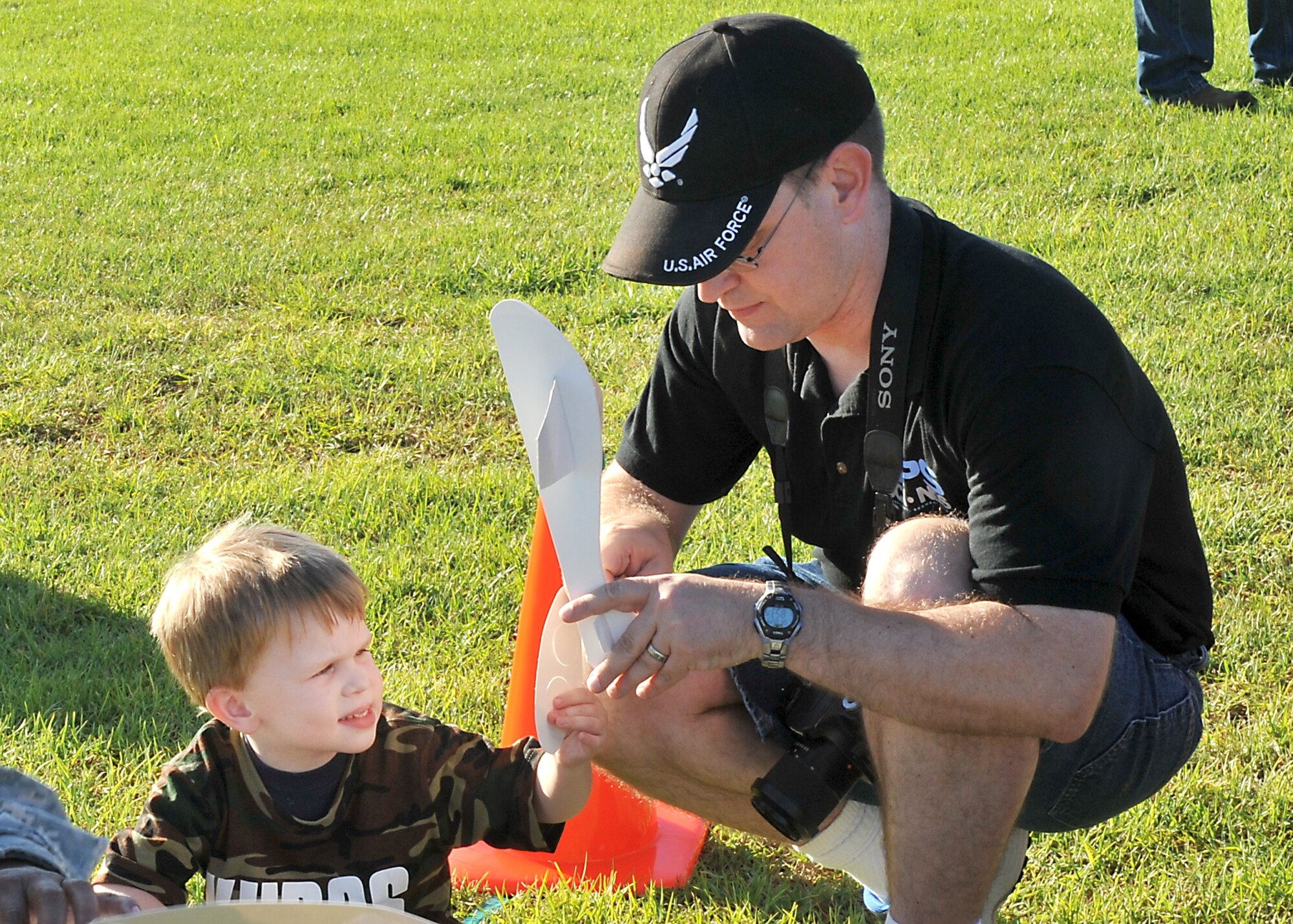 A father and son work on their aircraft building skills during the annual Kids Understanding Deployment Operations event, Oct. 24, on the Los Angeles Air Force Base parade grounds at Fort MacArthur in San Pedro, Calif. More than 150 military, DoD and contractor’s children and teens experienced first-hand what their military parent’s experience when deployed. (U.S. Air Force photo/Sarah Corrice) 