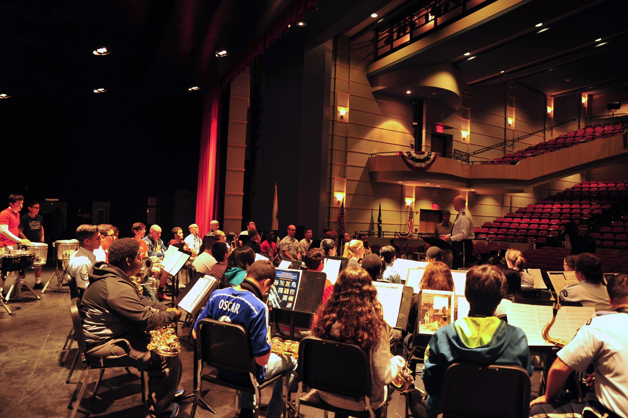 Maj. David Alpar addresses a side-by-side rehearsal of Air Force Band members and Everett High School students. (Photo by A1C Latasia Gross/released)