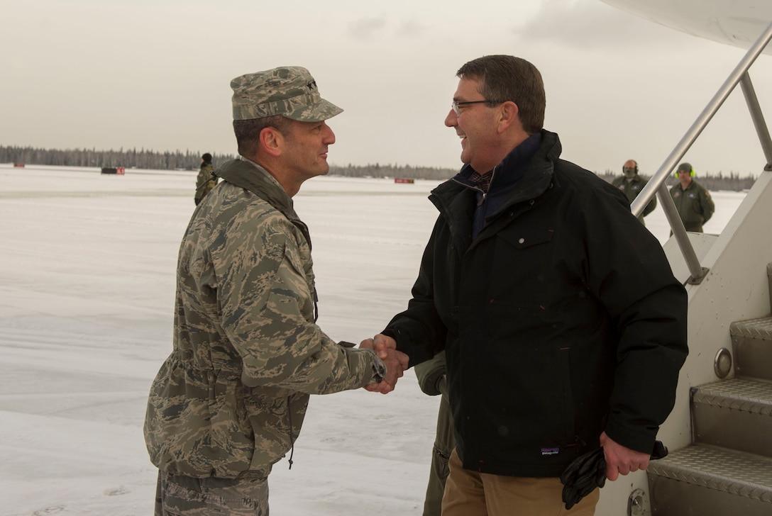 Defense Secretary Ash Carter, right, shakes hands with Air Force Lt. Gen. Russell J. Handy, commander of U.S. Northern Command's Alaskan Command, as the secretary arrives at Fort Wainwright, Alaska, Oct. 30, 2015. Carter is visiting the Asia-Pacific region, where he will meet with leaders from more than a dozen nations to help advance the next phase of the U.S. military’s rebalance in the region by modernizing longtime alliances and building new partnerships. DoD Photo by Air Force Senior Master Sgt. Adrian Cadiz
