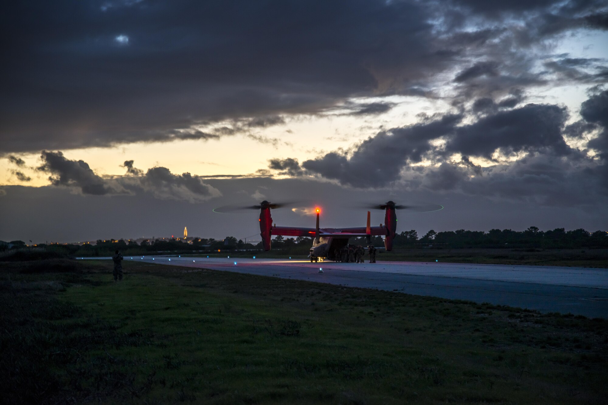 A CV-22 Osprey from the 352d Special Operations Wing reloads its passengers during a training exercise at Air Base 6 Montijo, Portugal, Oct. 27, 2015. The CV-22 Osprey is a tiltrotor aircraft that combines the vertical takeoff, hover and vertical landing qualities of a helicopter with the long-range, fuel efficiency and speed characteristics of a turboprop aircraft. Its mission is to conduct long-range infiltration, exfiltration and resupply missions for special operations forces.. (U.S. Air Force photo by 1st Lt. Chris Sullivan/Released)