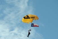 A member of the U.S. Army Golden Knights performs at the 2015 Joint Base San Antonio Air Show and Open House Oct.31, 2015, at JBSA-Randolph. The United States Army Parachute Team, nicknamed and commonly known as the Golden Knights, is a demonstration and competition parachute team of the United States Army.The demonstration teams, which use five dedicated aircraft, perform at more than 100 events per year. (U.S. Air Force photo by Joel Martinez/Released)