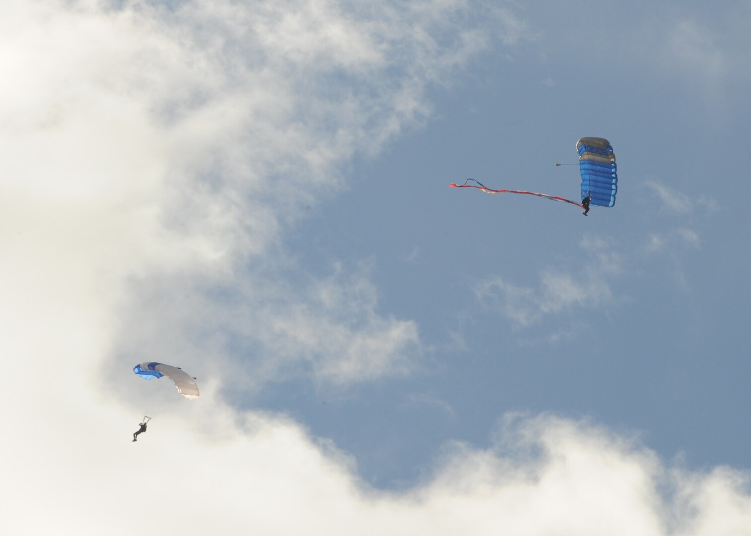 Members of the U.S. Air Force Wings of Blue perform during the 2015 Air Show and Open House at Joint Base San Antonio-Randolph Oct. 31, 2015. The Wings of Blue has both a demonstration team and a competition team. The demonstration team travels across the country to airshows, sporting events, and other venues to represent the Air Force in precision parachuting.  (U.S. Air Force photo by Melissa Peterson/released)