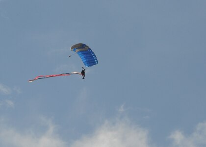 A member of the U.S. Air Force Wings of Blue parachute team performs during the 2015 Air Show and Open House at Joint Base San Antonio-Randolph Oct. 31, 2015. The Wings of Blue has both a demonstration team and a competition team. The demonstration team travels across the country to airshows, sporting events, and other venues to represent the Air Force in precision parachuting.  (U.S. Air Force photo by Melissa Peterson/released)