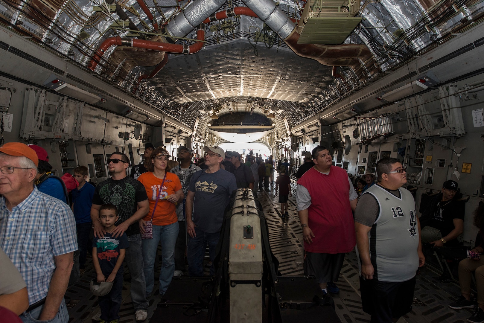 Visitors tour the inside of a C-17 Globemaster III during the Joint Base San Antonio Air Show and Open House Oct. 31, 2015 at JBSA-Randolph, Texas. Air shows allow the Air Force to display the capabilities of our aircraft to the American taxpayer through aerial demonstrations and static displays. JBSA-Randolph’s air show allowed attendees to get up close and personal to see some of the equipment and aircraft used by the U.S. military today.