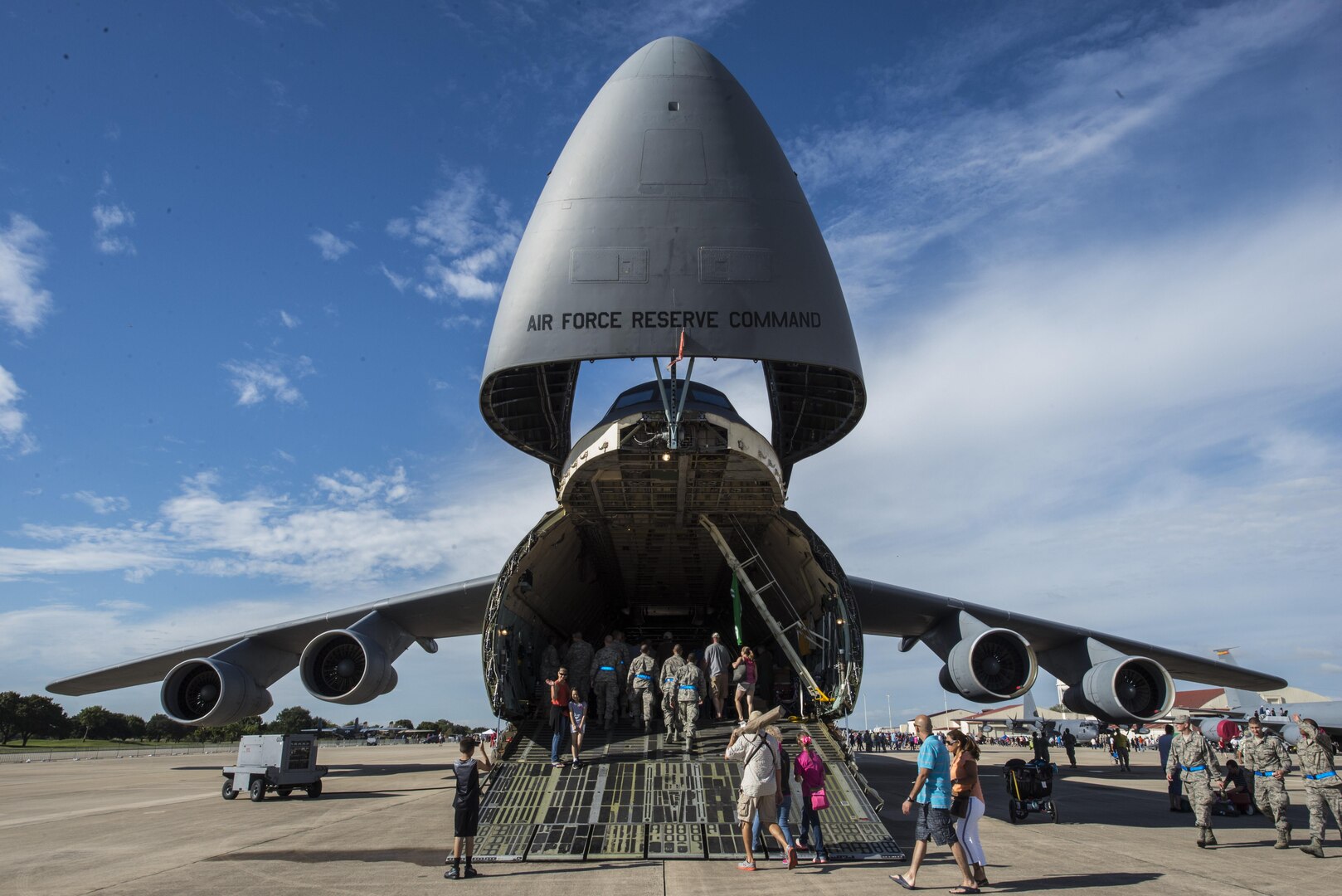 Visitors board a C-5 Galaxy during the Joint Base San Antonio Air Show and Open House Oct. 31, 2015, at JBSA-Randolph, Texas. Air shows allow the Air Force to display the capabilities of our aircraft to the American taxpayer through aerial demonstrations and static displays. JBSA-Randolph’s air show allowed attendees to get up close and personal to see some of the equipment and aircraft used by the U.S. military today.