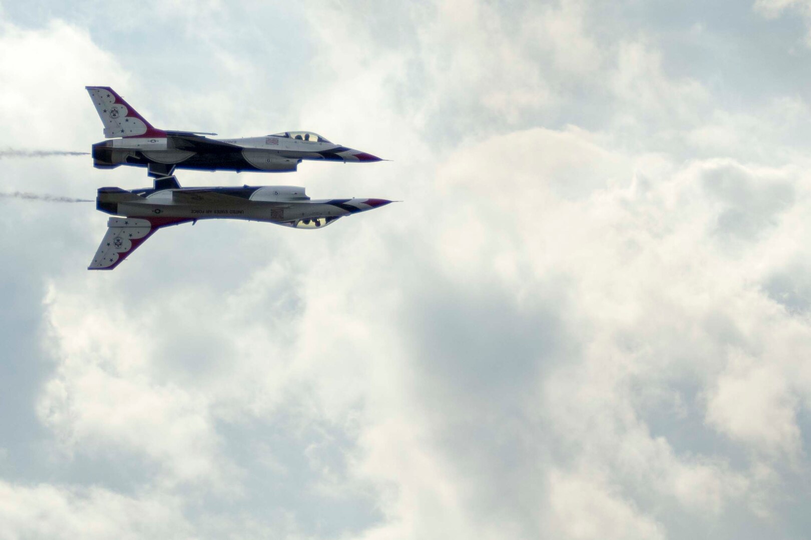 JBSA-Randolph - The U.S. Air Force Aerial Demonstration Squadron “Thunderbirds” performs F-16 acrobatic maneuvers Oct. 31, 2015 at Joint Base San Antonio-Randolph, Texas. The Thunderbirds team members perform for the 2015 JBSA-Randolph Air Show and Open House to be held Oct. 31 and Nov. 1. Air shows allow the Air Force to display the capabilities of our aircraft to the American taxpayer through aerial demonstrations and static displays and allowing attendees to get up close and personal to see some of the equipment and aircraft used by the U.S. military today. (U.S. Air Force photo by Joshua Rodriguez) 