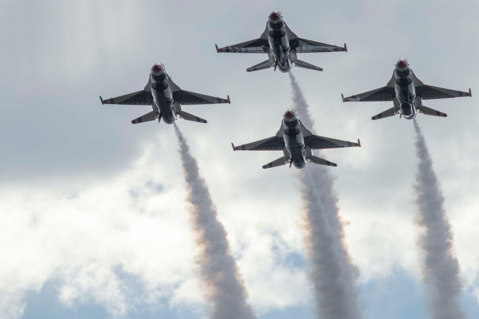 JBSA-Randolph - The U.S. Air Force Aerial Demonstration Squadron “Thunderbirds” performs F-16 acrobatic maneuvers Oct. 31, 2015 at Joint Base San Antonio-Randolph, Texas. The Thunderbirds team members perform for the 2015 JBSA-Randolph Air Show and Open House to be held Oct. 31 and Nov. 1. Air shows allow the Air Force to display the capabilities of our aircraft to the American taxpayer through aerial demonstrations and static displays and allowing attendees to get up close and personal to see some of the equipment and aircraft used by the U.S. military today. (U.S. Air Force photo by Joshua Rodriguez) 