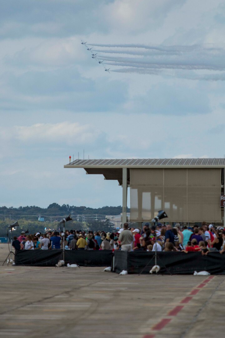JBSA-Randolph - The U.S. Air Force Aerial Demonstration Squadron “Thunderbirds” performs F-16 acrobatic maneuvers Oct. 31, 2015 at Joint Base San Antonio-Randolph, Texas. The Thunderbirds team members perform for the 2015 JBSA-Randolph Air Show and Open House to be held Oct. 31 and Nov. 1. Air shows allow the Air Force to display the capabilities of our aircraft to the American taxpayer through aerial demonstrations and static displays and allowing attendees to get up close and personal to see some of the equipment and aircraft used by the U.S. military today. (U.S. Air Force photo by Joshua Rodriguez) 