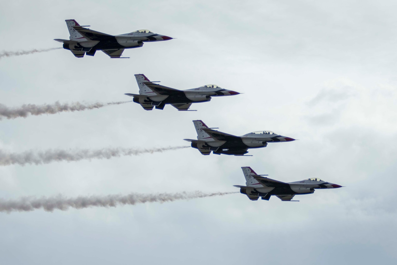 JBSA-Randolph - The U.S. Air Force Aerial Demonstration Squadron “Thunderbirds” performs F-16 acrobatic maneuvers Oct. 31, 2015 at Joint Base San Antonio-Randolph, Texas. The Thunderbirds team members perform for the 2015 JBSA-Randolph Air Show and Open House to be held Oct. 31 and Nov. 1. Air shows allow the Air Force to display the capabilities of our aircraft to the American taxpayer through aerial demonstrations and static displays and allowing attendees to get up close and personal to see some of the equipment and aircraft used by the U.S. military today. (U.S. Air Force photo by Joshua Rodriguez) 
