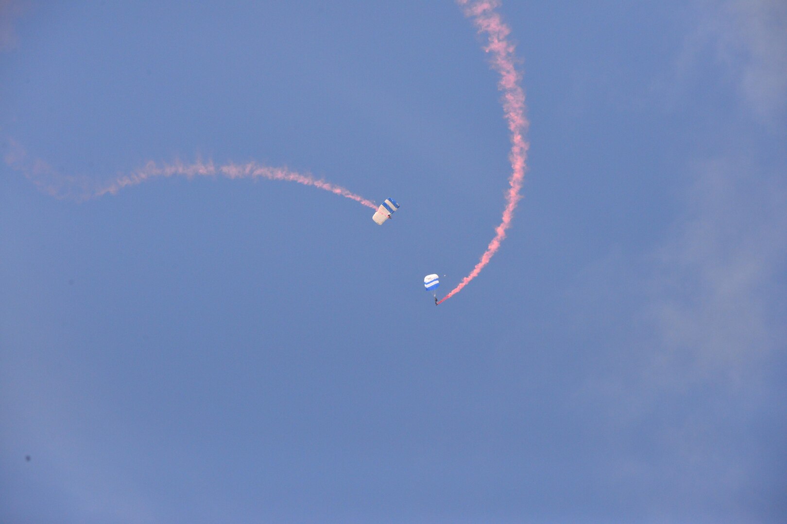 The U.S. Air Force Wings of Blue perform during the 2015 Air Show and Open House at Joint Base San Antonio-Randolph Oct. 31, 2015. The Wings of Blue has both a demonstration team and a competition team. The demonstration team travels across the country to airshows, sporting events, and other venues to represent the Air Force in precision parachuting.  (U.S. Air Force photo by Olivia Mendoza/released)
