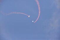 The U.S. Air Force Wings of Blue perform during the 2015 Air Show and Open House at Joint Base San Antonio-Randolph Oct. 31, 2015. The Wings of Blue has both a demonstration team and a competition team. The demonstration team travels across the country to airshows, sporting events, and other venues to represent the Air Force in precision parachuting.  (U.S. Air Force photo by Olivia Mendoza/released)
