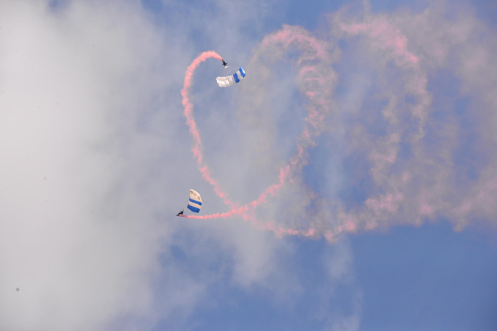The U.S. Air Force Wings of Blue perform during the 2015 Air Show and Open House at Joint Base San Antonio-Randolph Oct. 31, 2015. The Wings of Blue has both a demonstration team and a competition team. The demonstration team travels across the country to airshows, sporting events, and other venues to represent the Air Force in precision parachuting.  (U.S. Air Force photo by Olivia Mendoza/released)
