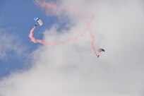 The U.S. Air Force Wings of Blue perform during the 2015 Air Show and Open House at Joint Base San Antonio-Randolph Oct. 31, 2015. The Wings of Blue has both a demonstration team and a competition team. The demonstration team travels across the country to airshows, sporting events, and other venues to represent the Air Force in precision parachuting.  (U.S. Air Force photo by Olivia Mendoza/released)
