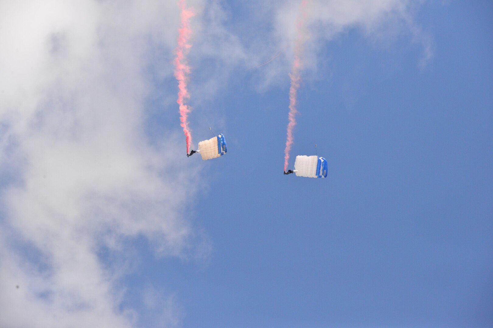 The U.S. Air Force Wings of Blue perform during the 2015 Air Show and Open House at Joint Base San Antonio-Randolph Oct. 31, 2015. The Wings of Blue has both a demonstration team and a competition team. The demonstration team travels across the country to airshows, sporting events, and other venues to represent the Air Force in precision parachuting.  (U.S. Air Force photo by Olivia Mendoza/released)
