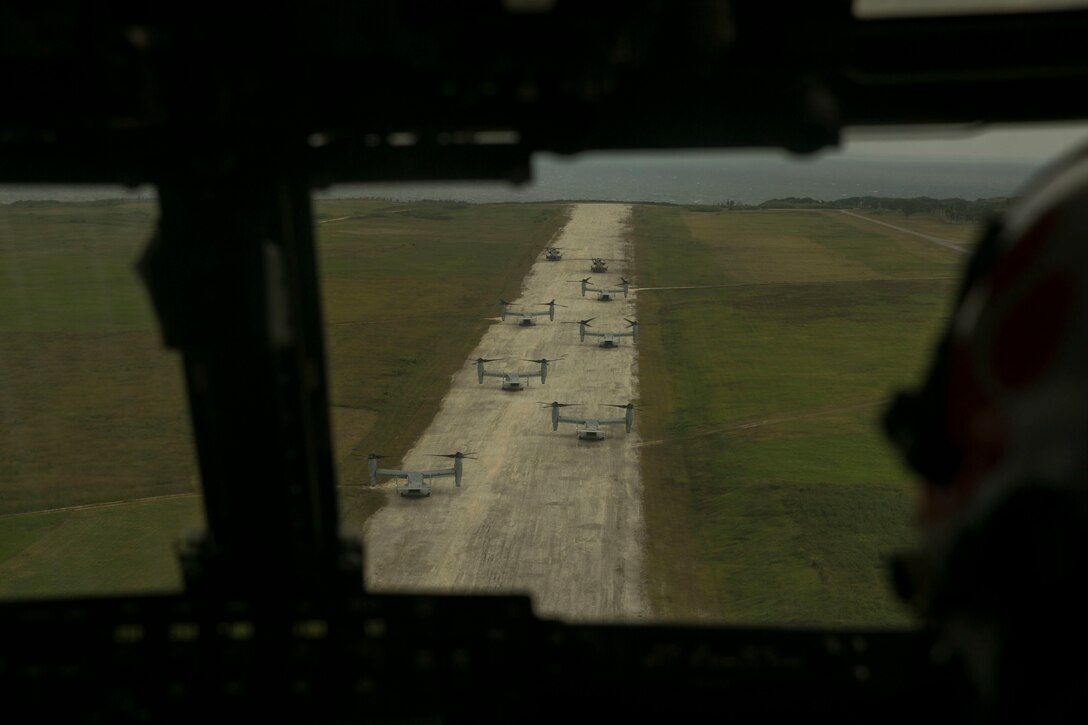 Six MV-22B Ospreys and two CH-53E Super Stallions prepare to take off after deploying a battalion of infantry Marines on Ie Shima, Okinawa, Japan, during a regimental air assault as part of Blue Chromite 16, Oct. 31. Blue Chromite is an amphibious exercise conducted by Marines in the ground, logistics and air combat elements of III Marine Expeditionary Force. The Ospreys are with Marine Medium Tiltrotor Squadron 262, Marine Aircraft Group 36, 1st Marine Airwing, III MEF. The Super Stallions are with Marine Heavy Helicopter Squadron 462, MAG 16, 2nd MAW, II MEF, currently attached to MAG 36, 1st MAW, III MEF, under the unit deployment program.  The infantry Marines are with 1st Battalion, 2nd Marine Regiment, currently under command of 4th Marines, 3rd MarDiv, III MEF, as part of the unit deployment program. (U.S. Marine Corps photo by Cpl. William Hester/ Released)