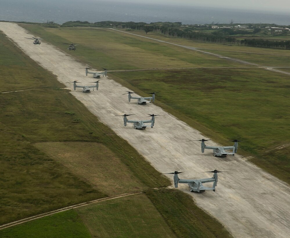 Six MV-22B Ospreys and two CH-53E Super Stallions prepare to take off after deploying a battalion of infantry Marines onto the island of Ie Shima, Okinawa, Japan, for a regimental air assault during Blue Chromite 2016, Oct. 31, 2015. Blue Chromite is an amphibious exercise conducted by Marines in the ground, logistics and air combat elements of III Marine Expeditionary Force. The Super Stallions are with Marine Heavy Helicopter Squadron 462, Marine Aircraft Group 16, 2nd Marine Aircraft Wing, II MEF, currently attached to MAG 36, 1st MAW, III MEF. The Ospreys are with MAG 36, 1st MAW, III MEF. The infantry Marines are with 1st Battalion, 2nd Marine Regiment, 2nd Marine Division, II MEF, currently under the command of 4th Marines, 3rd MarDiv, III MEF. (U.S. Marine Corps photo by Cpl. William Hester/ Released)