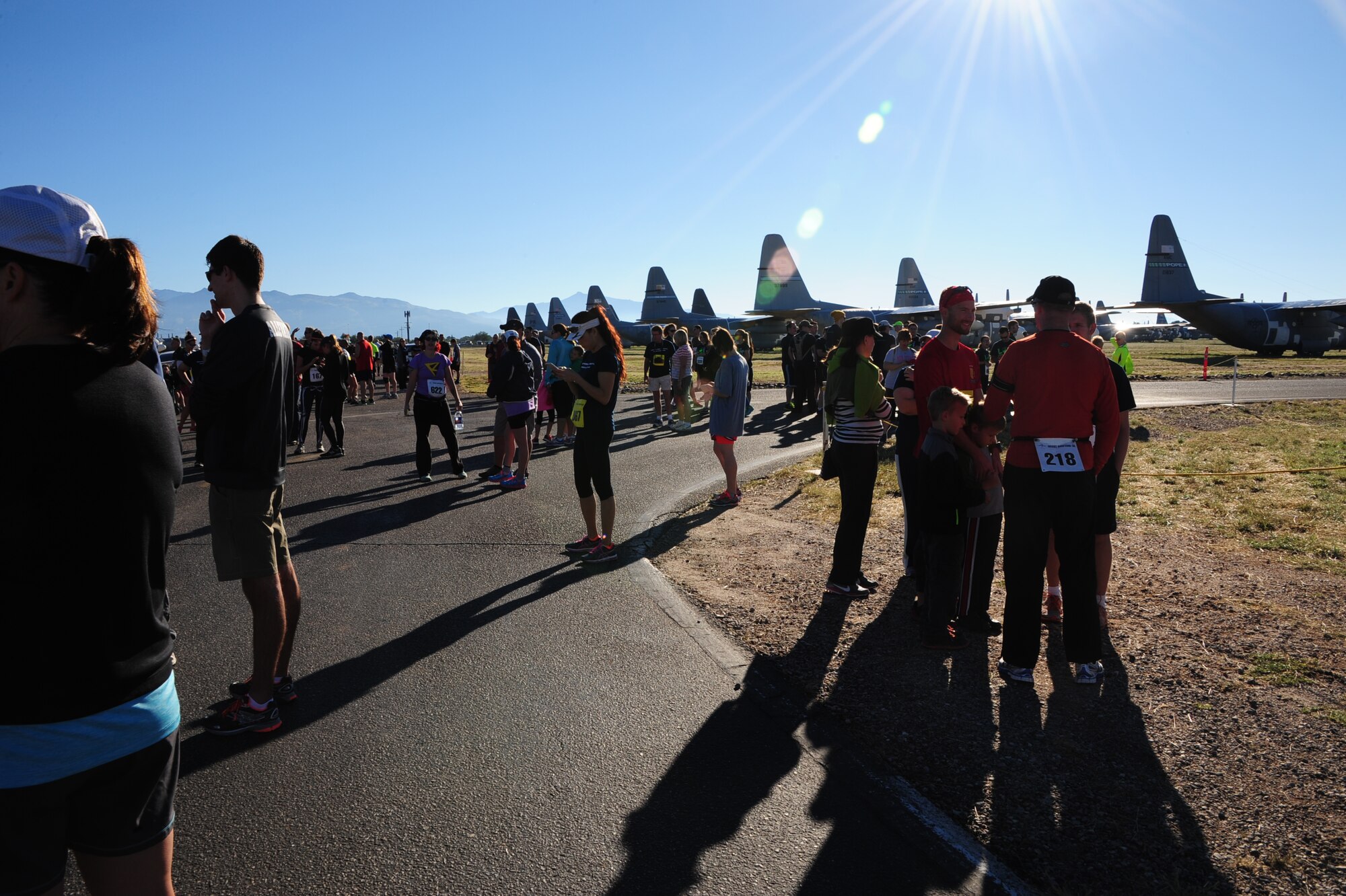 Participants of the Desert Boneyard 10K Run & 5K Run/Walk wait for the race to begin at the 309th Aerospace Maintenance and Regeneration Group, Davis-Monthan Air Force Base, Ariz., Oct. 31, 2015. This event gave the general public a rare opportunity to access the 309th AMARG that is usually only available to authorized personnel and guided bus tours. (U.S. Air Force photo by Airman Basic Nathan H. Barbour/Released)