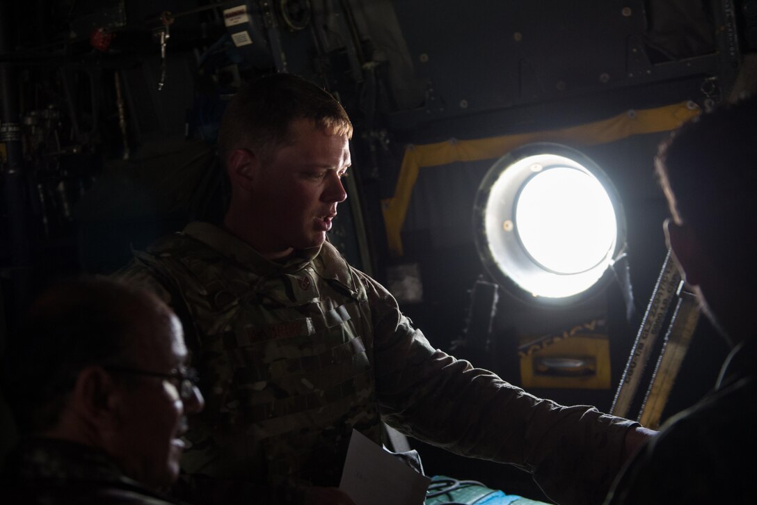 U.S. Air Force Staff Sgt. John Maurer, 774th Expeditionary Airlift Squadron AFE noncommissioned officer in charge, goes over C-130H Hercules aircraft post flight inspection of AFE with Afghan airmen at Hamid Karzai International Airport, Kabul, Afghanistan, Aug. 29, 2015. Airmen with the 455th Air Expeditionary Wing visited Forward Operating Base Oqab and Hamid Karzai International Airport to share their aircrew flight equipment knowledge with their Afghan counterparts and also assist TAAC-Air with keeping Coalition AFE equipment current. (U.S. Air Force photo by Tech. Sgt. Joseph Swafford/Released)