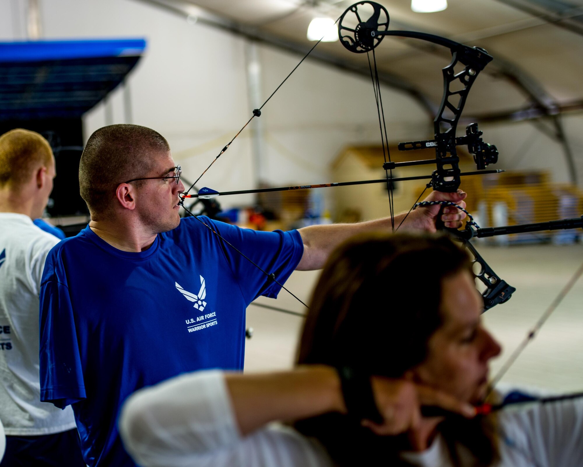 A Wounded Warrior aims a bow while participating in archery training during the Air Force Wounded Warrior Program Warrior Care event, Aug. 26, 2015 at Joint Base Lewis-McChord, Wash. The Warrior Care event featured adaptive and rehabilitative sports, activities, career readiness, recovering Airman mentorship and caregiver training. It was an opportunity for all wounded, ill and injured service members to engage in friendly competition. Wounded Warriors from JBLM and veterans from the northwest region were all invited to participate in the camp. (U.S. Air Force Reserve photo by Senior Airman Daniel Liddicoet