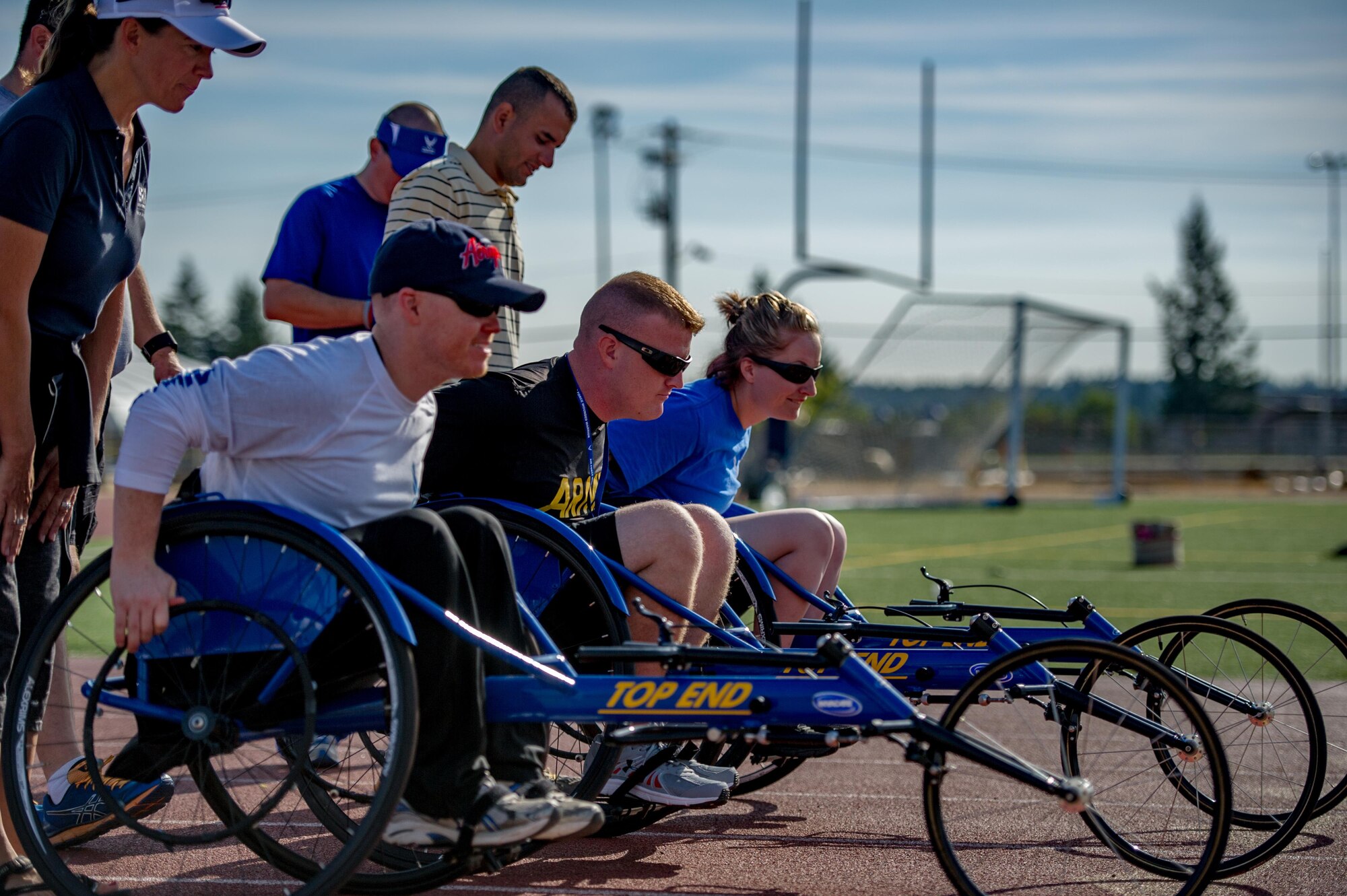 Wounded Warriors prepare to race in a wheel chairs while participating in track and field training during the Air Force Wounded Warrior Program Warrior Care event, Aug. 26, 2015 at Joint Base Lewis-McChord, Wash. The Warrior Care event featured adaptive and rehabilitative sports, activities, career readiness, recovering Airman mentorship and caregiver training. It was an opportunity for all wounded, ill and injured service members to engage in friendly competition. Wounded Warriors from JBLM and veterans from the northwest region were all invited to participate in the camp. (U.S. Air Force Reserve photo by Senior Airman Daniel Liddicoet)
