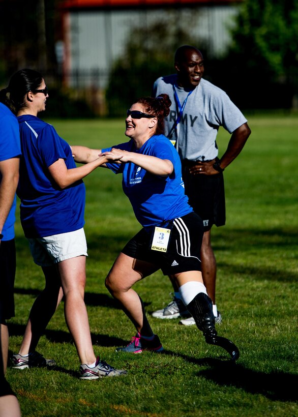 A Wounded Warrior stretches prior to participating in track and field training during the Air Force Wounded Warrior Program Warrior Care event, Aug. 26, 2015 at Joint Base Lewis-McChord, Wash. The Warrior Care event featured adaptive and rehabilitative sports, activities, career readiness, recovering Airman mentorship and caregiver training. It was an opportunity for all wounded, ill and injured service members to engage in friendly competition. Wounded Warriors from JBLM and veterans from the northwest region were all invited to participate in the camp. (U.S. Air Force Reserve photo by Senior Airman Daniel Liddicoet)