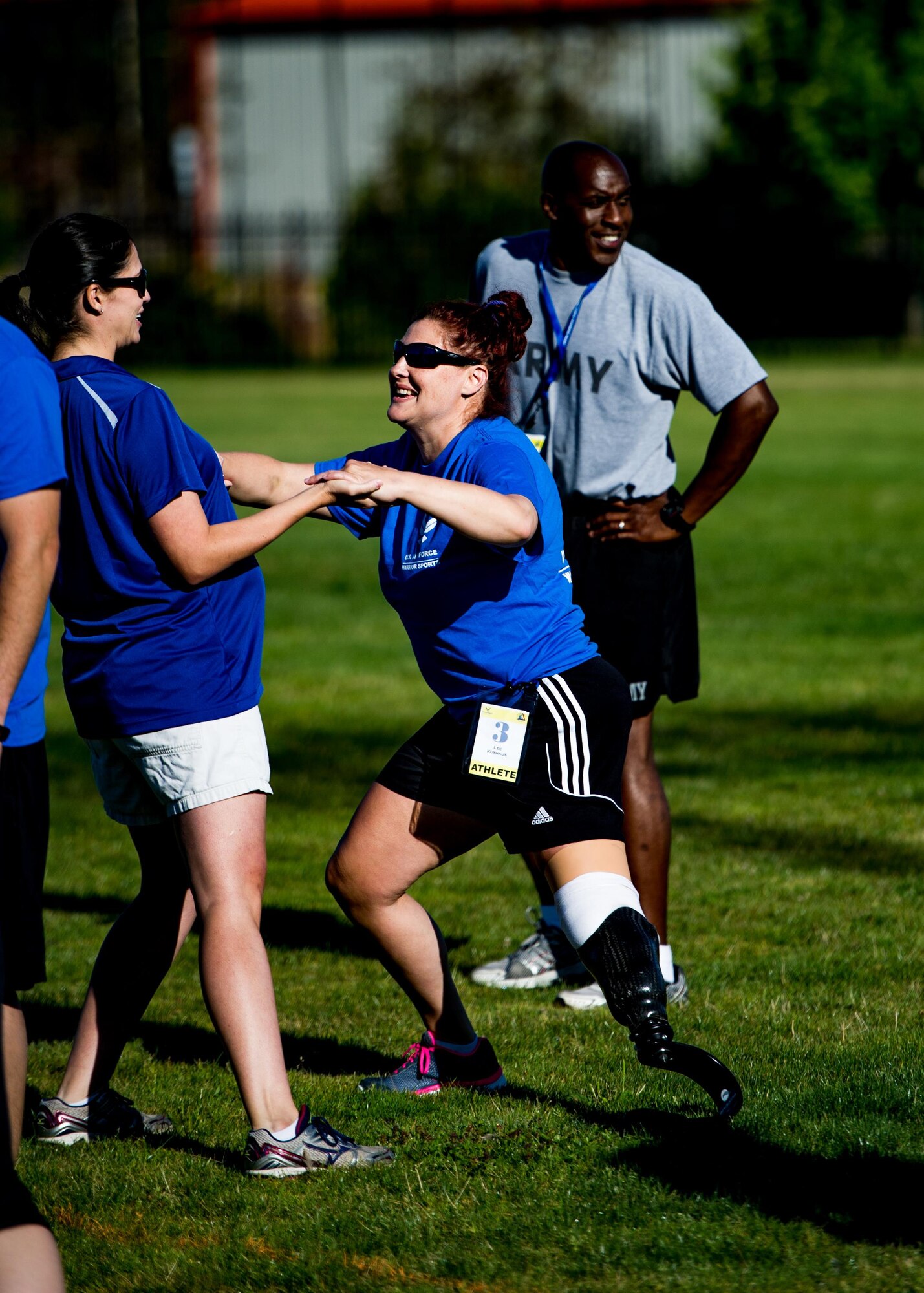 A Wounded Warrior stretches prior to participating in track and field training during the Air Force Wounded Warrior Program Warrior Care event, Aug. 26, 2015 at Joint Base Lewis-McChord, Wash. The Warrior Care event featured adaptive and rehabilitative sports, activities, career readiness, recovering Airman mentorship and caregiver training. It was an opportunity for all wounded, ill and injured service members to engage in friendly competition. Wounded Warriors from JBLM and veterans from the northwest region were all invited to participate in the camp. (U.S. Air Force Reserve photo by Senior Airman Daniel Liddicoet)