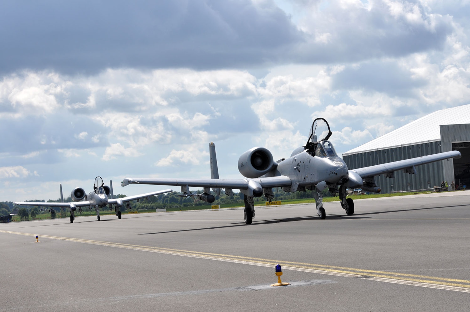 Two A-10 Thunderbolt IIs with the 303d Fighter Squadron that falls under the 442d Fighter Wing out of Whiteman Air Force Base, Mo., land at Leilvarde Air Base in Latvia Aug. 26. These are the first two fighter jets to ever land here making history on this day. This mission is part of Operation Atlantic Resolve where U.S. forces are strengthening their relationship by working, training, and partnering with European allies. (U.S. Air Force photo by Capt. Denise Haeussler)