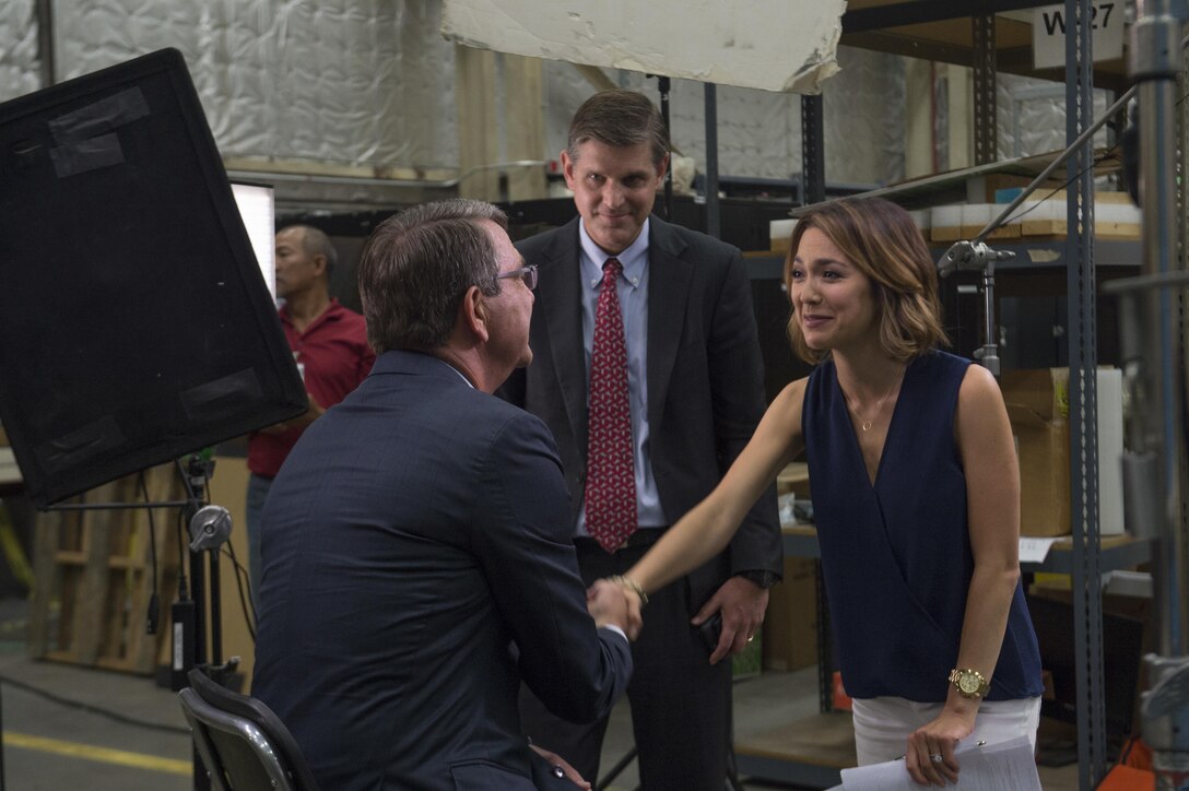 Defense Secretary Ash Carter shakes hands with Emily Chang from Bloomberg West after an interview during a visit to Moffett Field, Calif., Aug. 28, 2015. DoD photo by U.S. Air Force Master Sgt. Adrian Cadiz