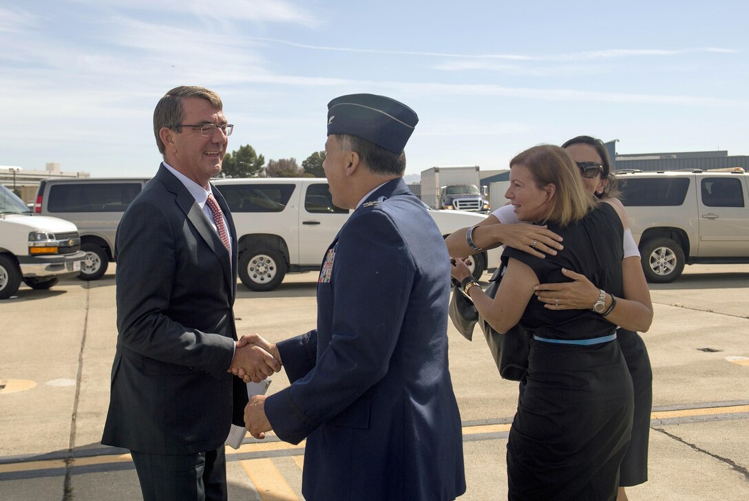 Defense Secretary Ash Carter shakes hands with Air Force Col. Daniel Lapostole, vice commander of the 129th Rescue Wing, as he arrives at Moffett Field, Calif., Aug. 28, 2015, to visit the Defense Innovation Unit Experimental and speak at the Manufacturing Innovation Institute event at the National Full Scale Aerodynamics Complex. DoD photo by U.S. Air Force Master Sgt. Adrian Cadiz