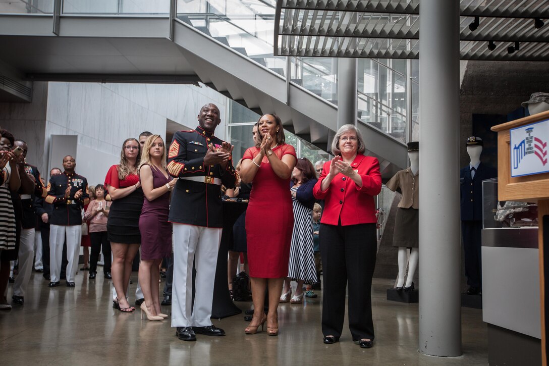 The 18th Sergeant Major of the Marine Corps, Ronald L. Green, hosts a sunset parade at the Marine Corps War Memorial, Arlington, Va., August 11, 2015. The Honorable Mrs. Holly Petraeus, Assistant Director, Service Member Affairs at the Consumer Financial Protection Bureau, was the guest of honor at the parade. (U.S. Marine Corps photo by Sgt. Melissa Marnell, Office of the Sergeant Major of the Marine Corps/Released)