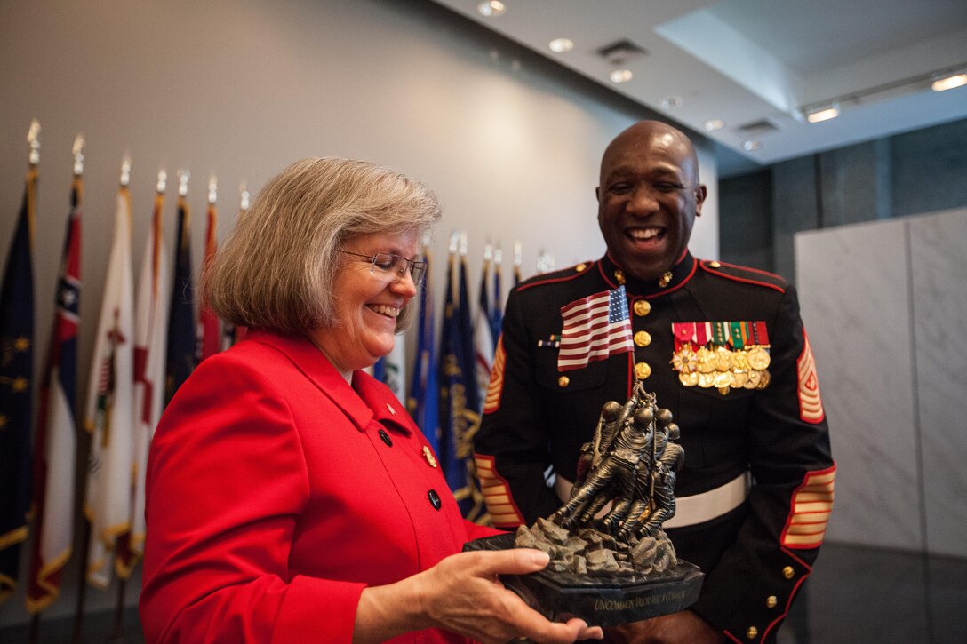 The 18th Sergeant Major of the Marine Corps, Ronald L. Green, hosts a sunset parade at the Marine Corps War Memorial, Arlington, Va., August 11, 2015. The Honorable Mrs. Holly Petraeus, Assistant Director, Service Member Affairs at the Consumer Financial Protection Bureau, was the guest of honor at the parade. (U.S. Marine Corps photo by Sgt. Melissa Marnell, Office of the Sergeant Major of the Marine Corps/Released)