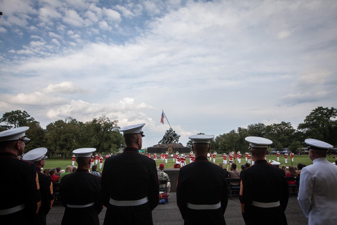 The 18th Sergeant Major of the Marine Corps, Ronald L. Green, hosts a sunset parade at the Marine Corps War Memorial, Arlington, Va., August 11, 2015. The Honorable Mrs. Holly Petraeus, Assistant Director, Service Member Affairs at the Consumer Financial Protection Bureau, was the guest of honor at the parade. (U.S. Marine Corps photo by Sgt. Melissa Marnell, Office of the Sergeant Major of the Marine Corps/Released)