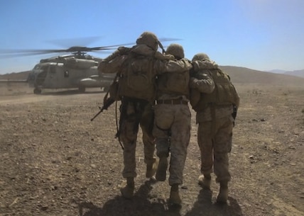 Marines with Combat Logistics Battalion 1, Combat Logistics Regiment 1, 1st Marine Logistics Group, help a simulated casualty to a CH-53E Super Stallion during a casualty evacuation drill aboard Marine Corps Air Ground Combat Center Twentynine Palms, California, Aug. 10, 2015. A simulated improvised explosive device attack left the Marines with a disabled vehicle and two wounded Marines awaiting evacuation by helicopter.

