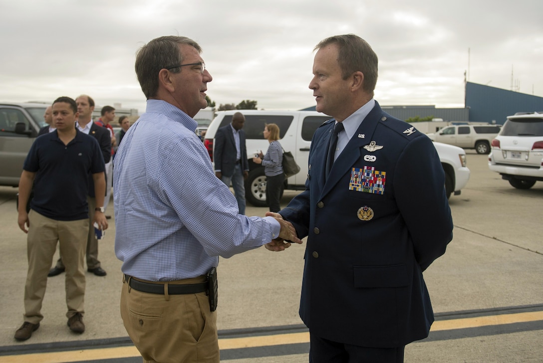 Air Force Col. Gregory Jones, commander of the 129th Rescue Wing, says farewell to Defense Secretary Ash Carter as Carter departs Moffett Field, Calif., Aug. 29, 2015, following a trip to California. DoD photo by U.S. Air Force Master Sgt. Adrian Cadiz