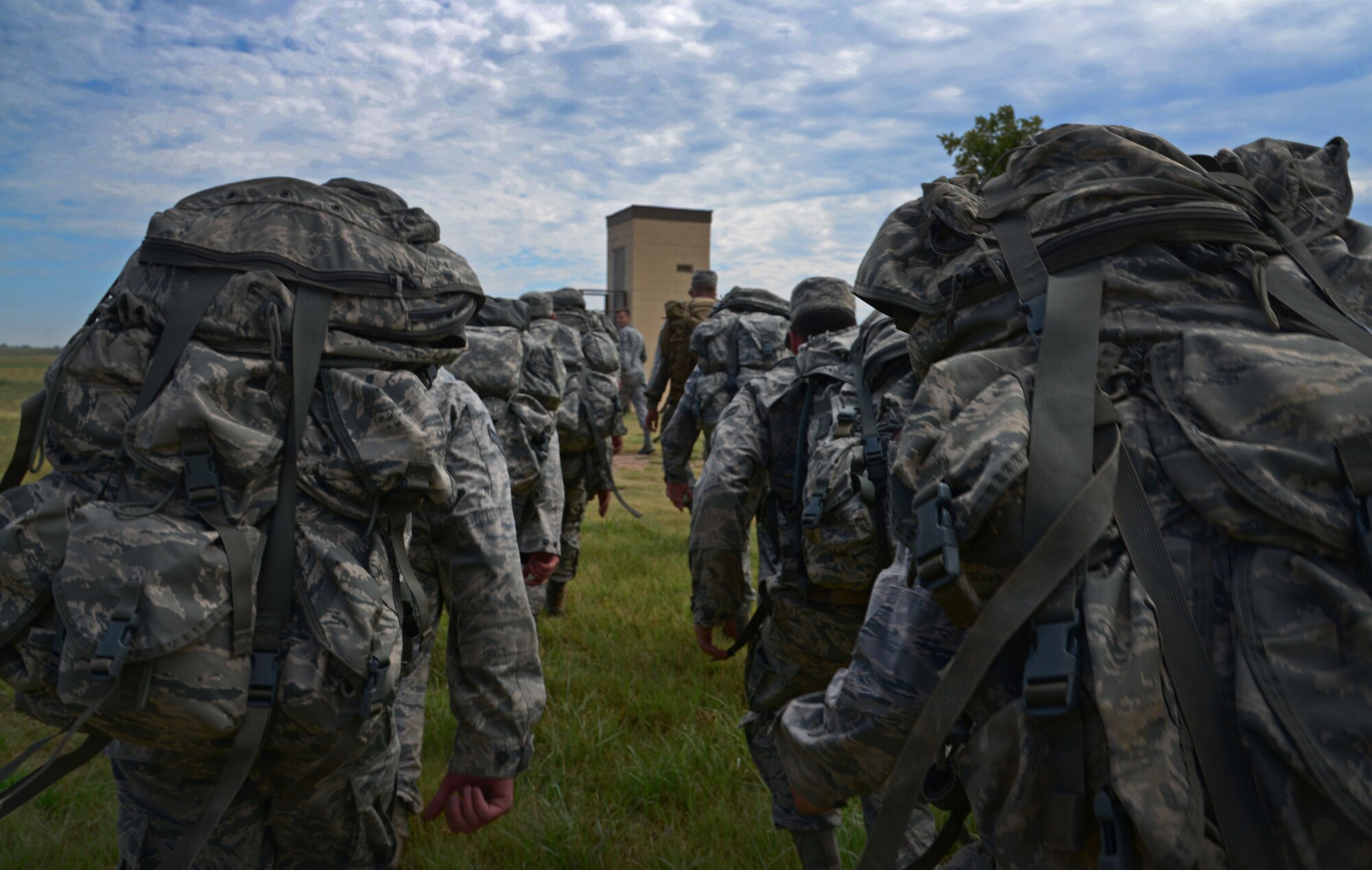 Members of the 27th Special Operations Security Forces Squadron stay together during a ruck march as part of pre-qualification for Deployed Aircraft Ground Response Element selection Aug. 17, 2015 at Cannon Air Force Base, N.M. The DAGRE training program at Cannon has recreated a very rigorous training environment to test and develop Air Commandos who have DAGRE team member aspirations. (U.S. Air Force photo/Staff Sgt. Alexx Mercer)