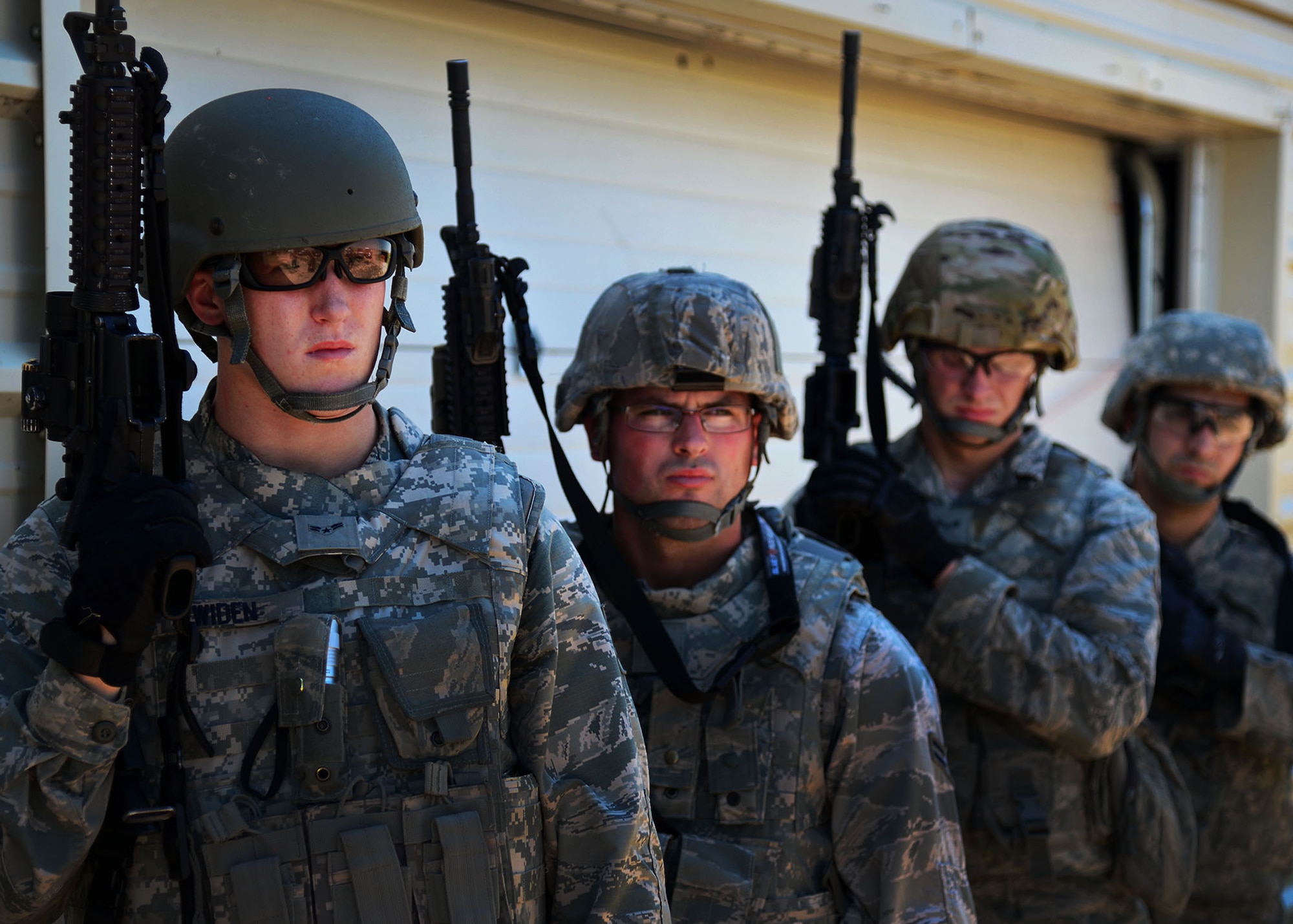 27th Special Operations Security Forces Squadron Airmen pay close attention to instruction as part of pre-qualification for Deployed Aircraft Ground Response Element selection Aug. 17, 2015 at Cannon Air Force Base, N.M. The DAGRE training program at Cannon has recreated a very rigorous training environment to test and develop Air Commandos who have DAGRE team member aspirations. (U.S. Air Force photo/Senior Airman Chip Slack)