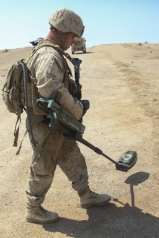 Cpl. Dale Stroud, a Marine with Combat Logistics Battalion 1, Combat Logistics Regiment 1, performs an improvised explosive device sweep in order to locate and remove IEDs from the area during Large Scale Exercise 15 aboard Marine Corps Air Ground Combat Center Twentynine Palms, Calif., Aug. 18, 2015. LSE-15 is a combined U.S. Marine Corps, Canadian and British exercise conducted at the brigade level, designed to enable live, virtual and constructive training for participating forces. (U.S. Marine Corps photo by Lance Cpl. Chris Garcia/Released)
