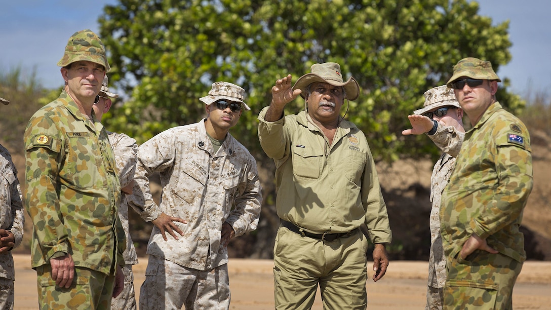 A Indigenous Larrakia Nation representative Eric Fejo (center) advises Australian Army and United States Marine Corps personnel on heritage concerns for Exercise Talisman Sabre 2015, at Fog Bay Northern Territory. 