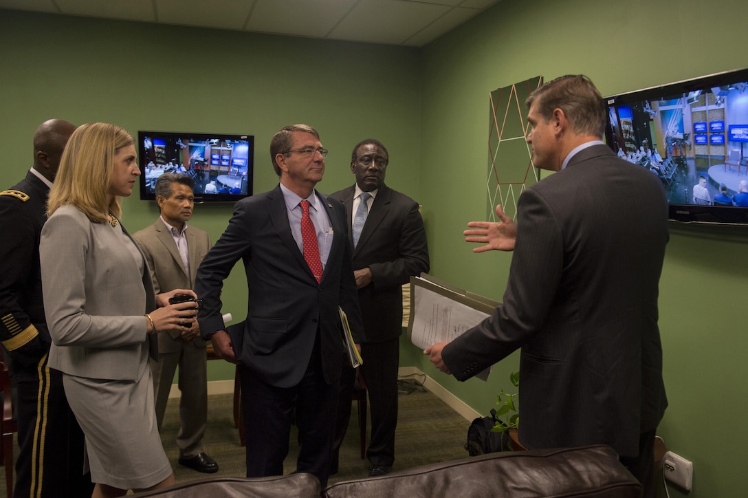Defense Secretary Ash Carter listens as Pentagon Press Secretary Peter Cook briefs him on the order of events before he hosts his first Worldwide Troop Talk at Defense Media Activity on Fort Meade, Md., Sept. 1, 2015. DoD photo by U.S. Air Force Senior Master Sgt. Adrian Cadiz