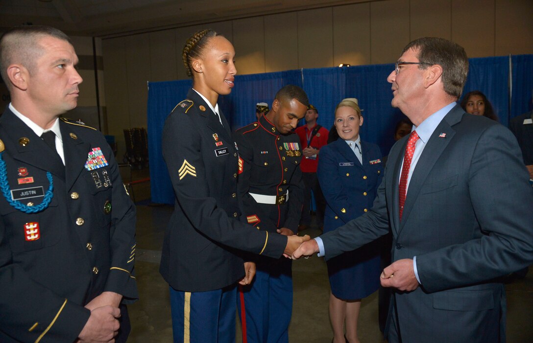 Defense Secretary Ash Carter shakes hands with an attendee of the American Legion Convention in Baltimore, Md., Sept. 1, 2015. DoD Photo by Glenn Fawcett 