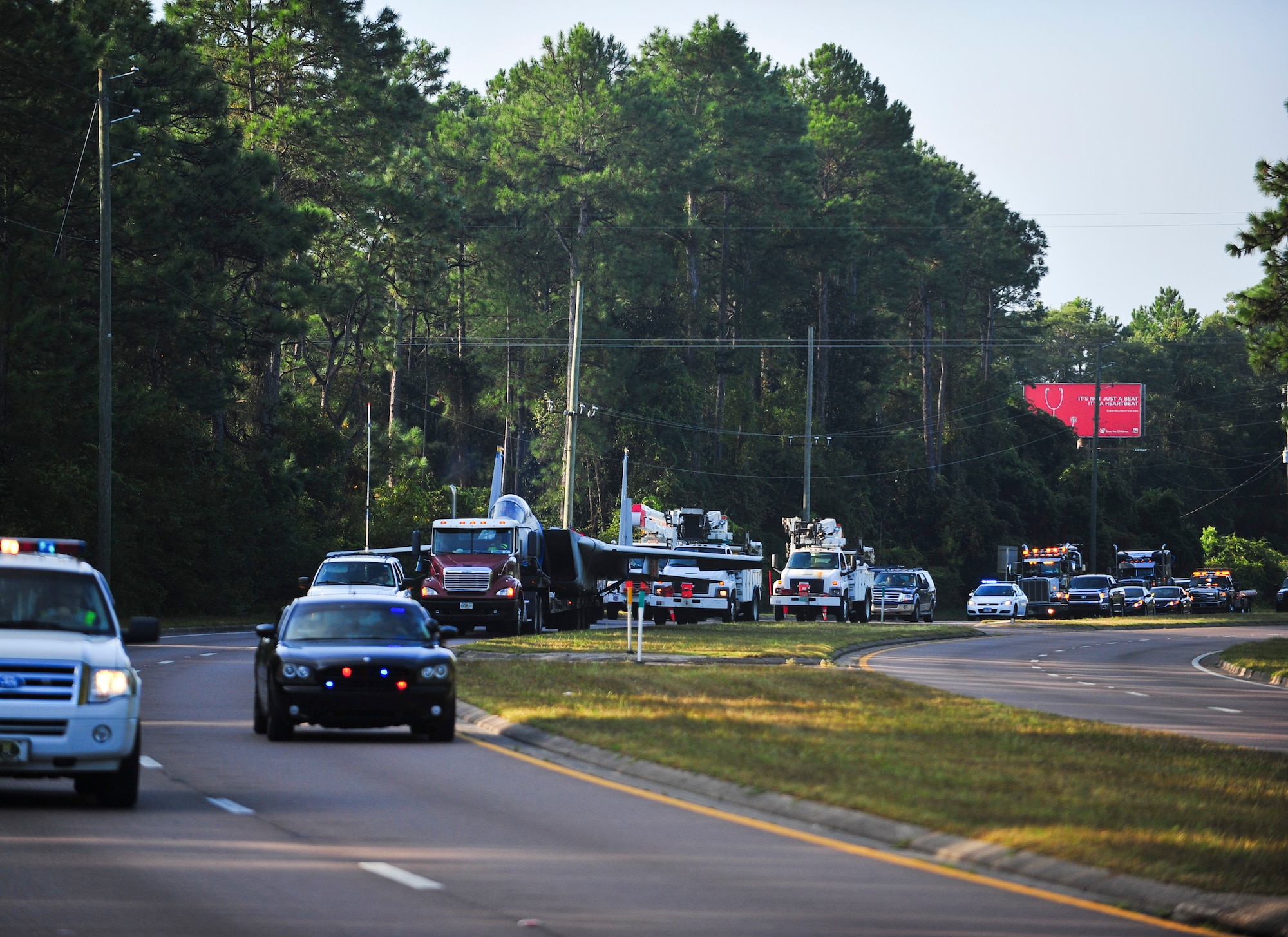 An F-15C Eagle is transported down the Highway 98 in Panama City, Fla. 30 Aug. The F-15 was transported to Haney Technical Center to be used to train future aircraft mechanics in their Aviation Academy. .  The Bay County Sherriff’s Office provided a police escort during the transportation to ensure safety to motorists on the route.  (U.S. Air Force photo by Airman 1st Class Dustin Mullen/Released)