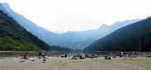 Attendees of a Single Airmen’s Retreat break for lunch in Glacier National Park, Mont., Aug. 29, 2015. Views of the pristine Avalanche Lake could be seen after hiking a two-and-a-half mile trail, known as the Trail of the Cedars. (U.S. Air Force photo/Airman 1st Class Collin Schmidt)