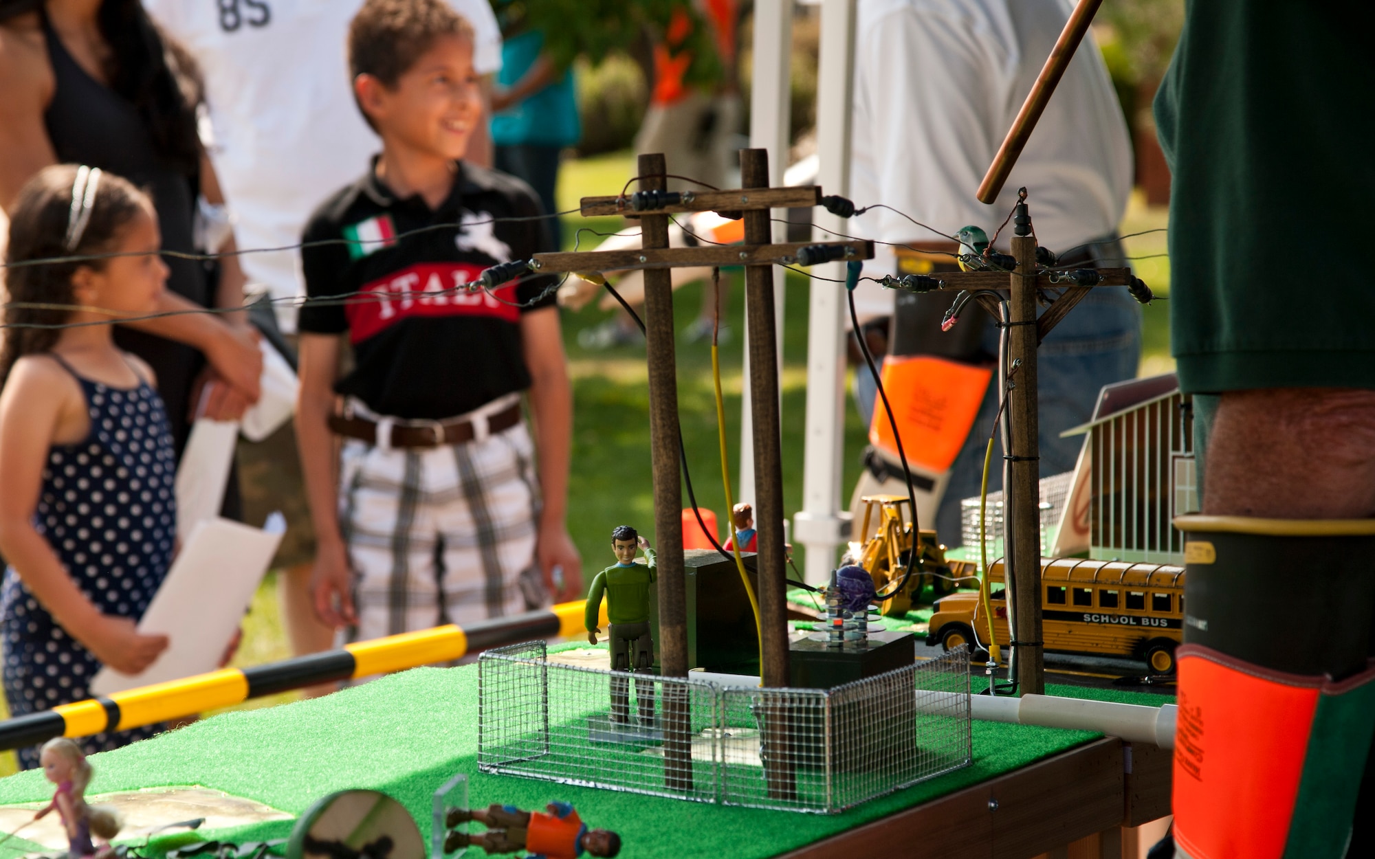 PETERSON AIR FORCE BASE, Colo. – A power line demonstration shows children why birds can safely land on power lines and also the precautions people should take around power lines during the Science, Technology, Engineering, and Math event at the Peterson Air and Space Museum, Aug. 29, 2015. The demonstration was one of many at the free annual event promoting STEM including National Forest Service, a cave simulator, dinosaurs and more. (U.S. Air Force photo by Senior Airman Tiffany DeNault)