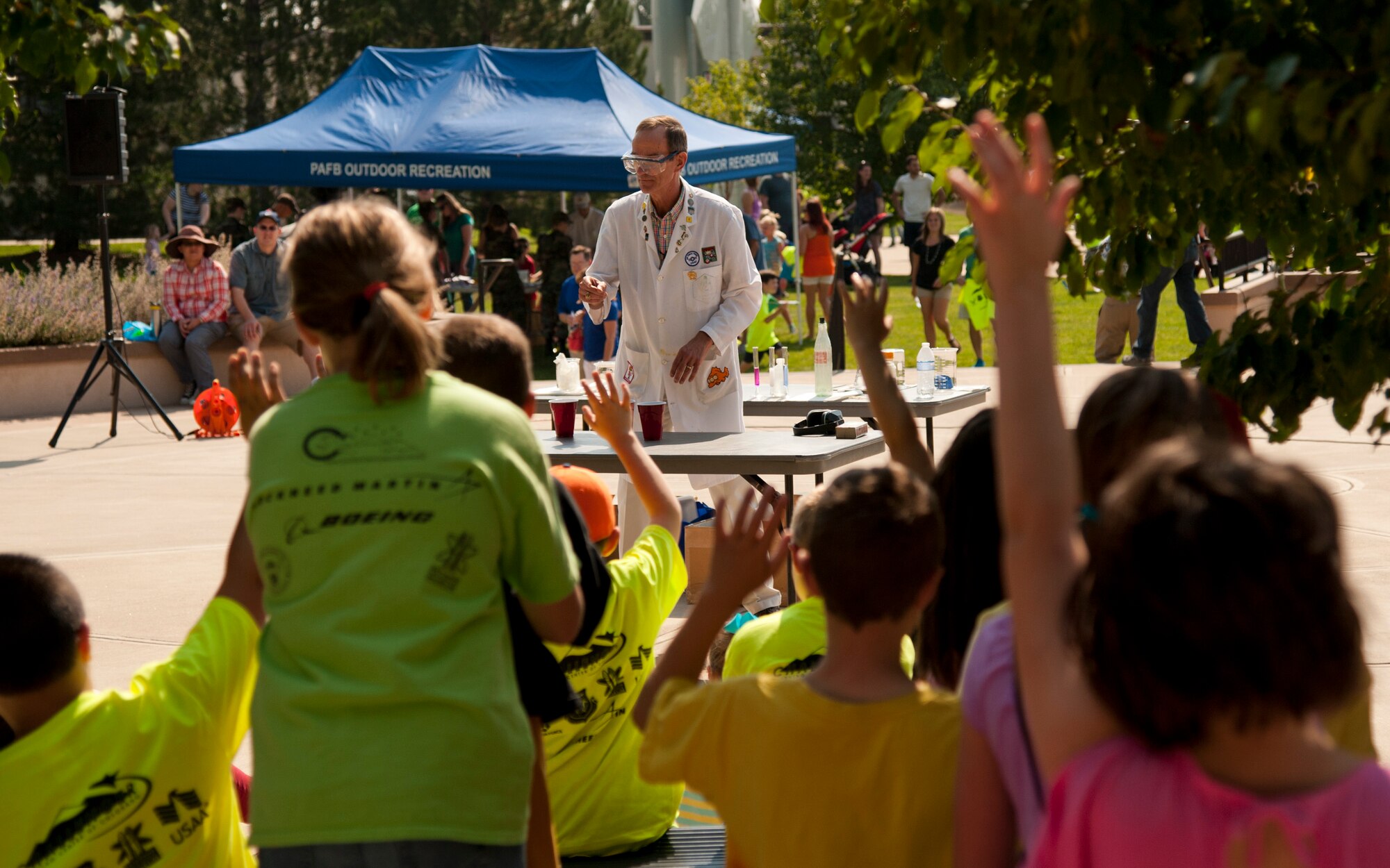PETERSON AIR FORCE BASE, Colo. – Ronald Furstenau, U.S. Air Force Academy, teaches military families basic chemistry during his chemistry magic show at the Science, Technology, Engineering, and Math event at the Peterson Air and Space Museum, Aug. 29, 2015. The chemistry magic show was one of many topics open to the children during the free annual event including rocket building/launching, a cave simulator, dinosaurs, electricity simulator and more. (U.S. Air Force photo by Senior Airman Tiffany DeNault)