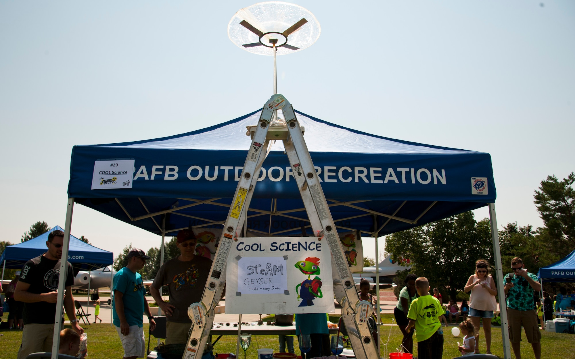 PETERSON AIR FORCE BASE, Colo. -  Military families attend the Science, Technology, Engineering, and Math event at the Peterson Air and Space Museum, Aug. 29, 2015. This is the fourth year Peterson AFB has held the event and the third year at the Air and Space Museum. The annual event promotes STEM to military children through various booths including paper rocket building/launching, a chemistry magic show, a cave simulator, and more. (U.S. Air Force photo by Senior Airman Tiffany DeNault)