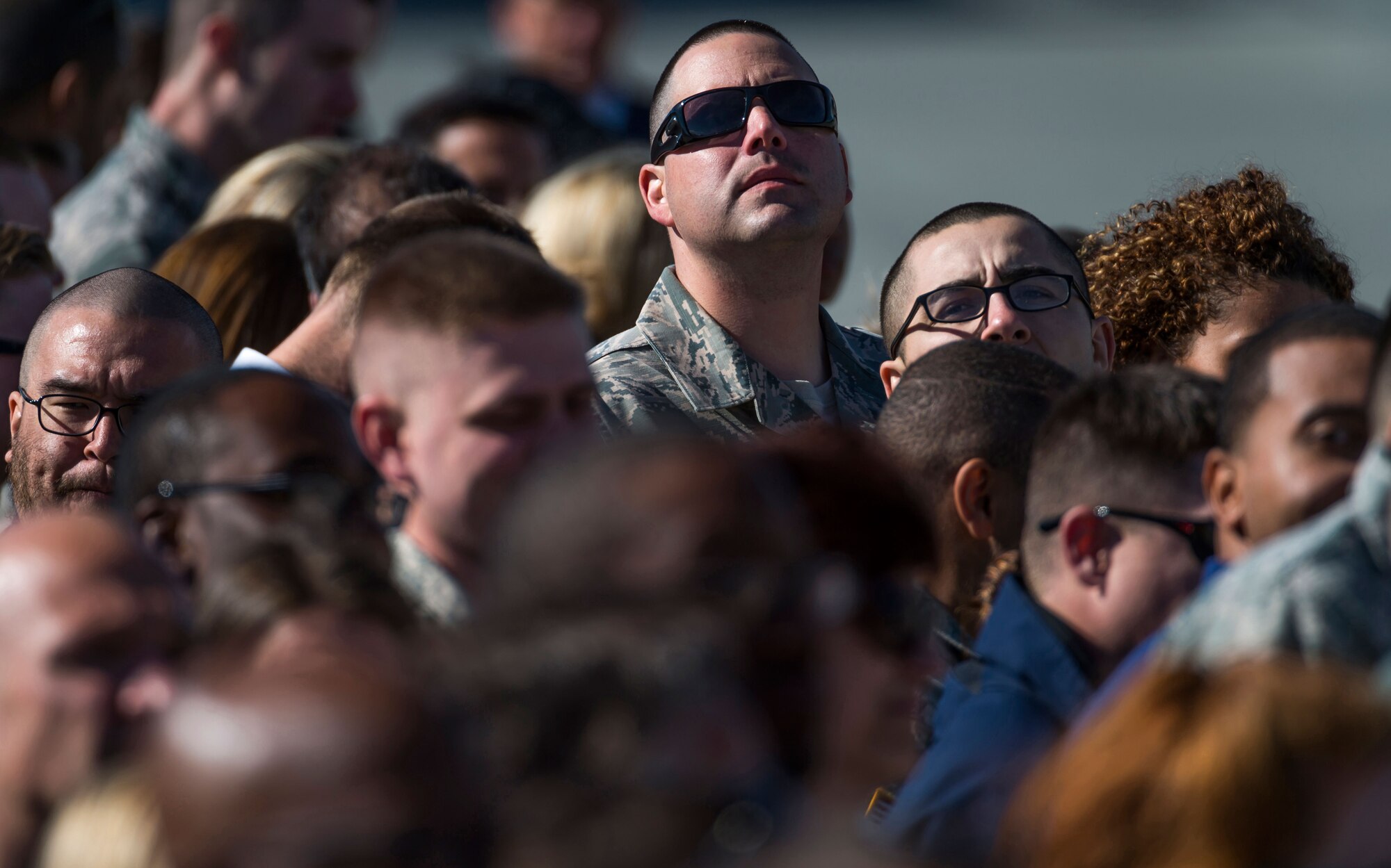 An Airman cranes his neck to get a glimpse of President Barack Obama, and Air Force One, at Joint Base Elmendorf-Richardson, Alaska, Monday, Aug. 31, 2015. President Obama was the main speaker at a major event yesterday in Anchorage, Alaska, hosted by the U.S. Department of State entitled the Conference on Global Leadership in the Arctic: Cooperation, Innovation, Engagement and Resilience (GLACIER). GLACIER will focus the world’s attention on the most urgent issues facing the Arctic today and provide an unprecedented opportunity for foreign ministers and key stakeholders to define the region’s most crucial challenges; highlight innovative ways in which these challenges can be addressed at the local, national and international levels; and broaden global awareness of the impacts of Arctic climate change.  (U.S. Air Force photo/Justin Connaher)
