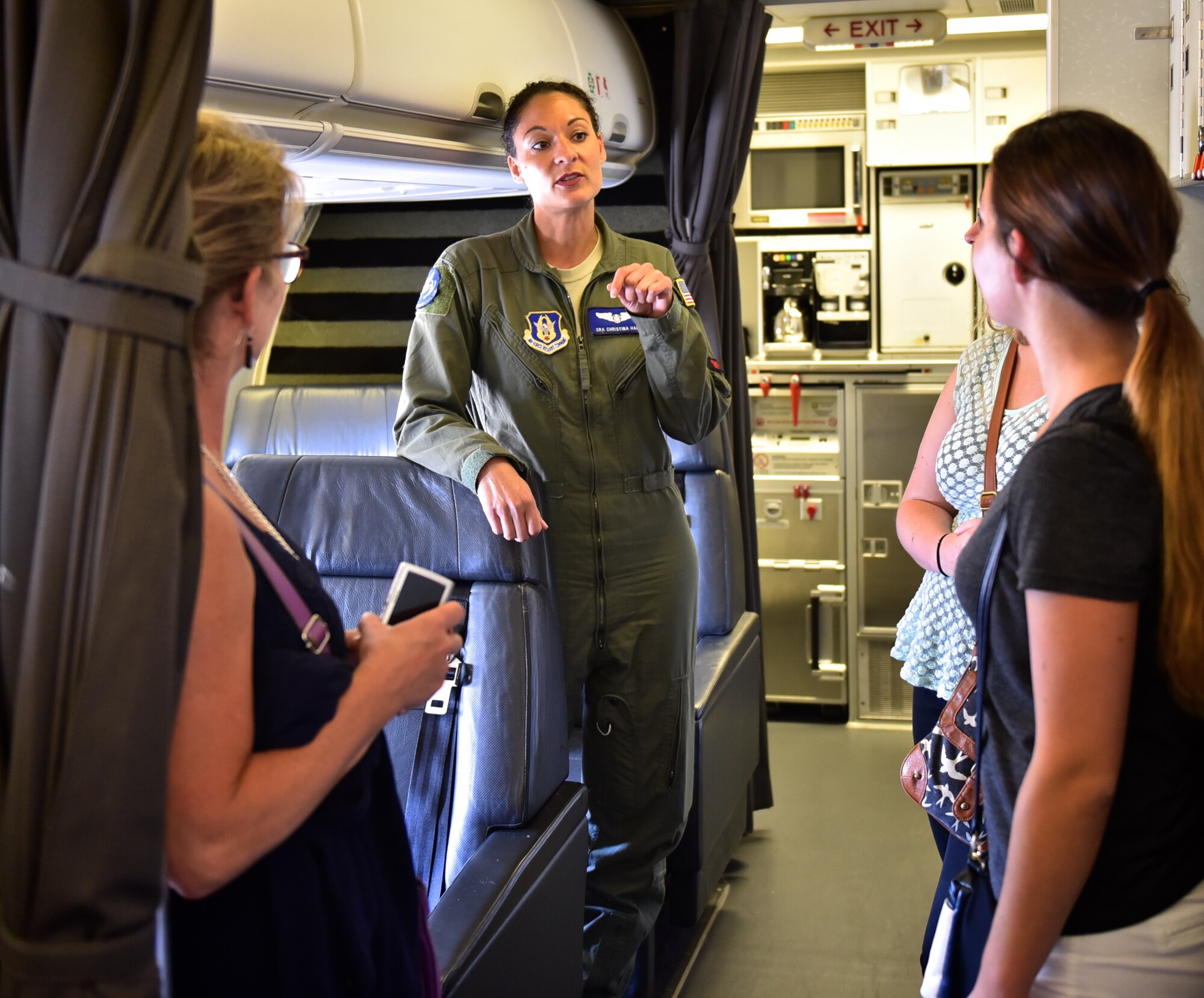 Senior Airman Christina Hall, a flight attendant from the 73rd Airlift Squadron at Scott Air Force Base, speaks to members of Women with Wings about the distinguished visitor transport mission and her role as a crewmember aboard the C-40C. (U.S. Air Force photo by Christopher Parr)